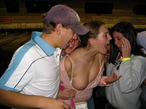 Friends expose her boobs at party.