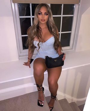 Ella in a really short and tight dress