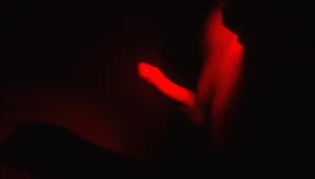 Red lighting cumshot.