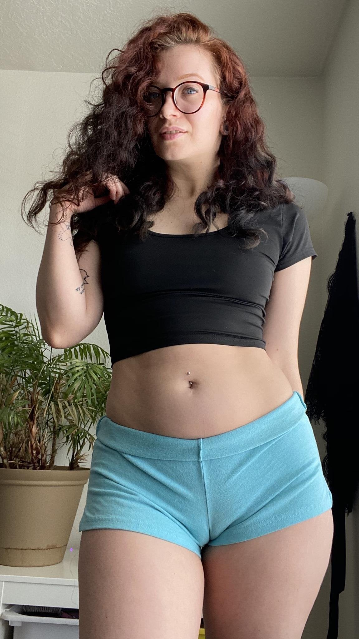 Red in glasses with sexy cameltoe shorts