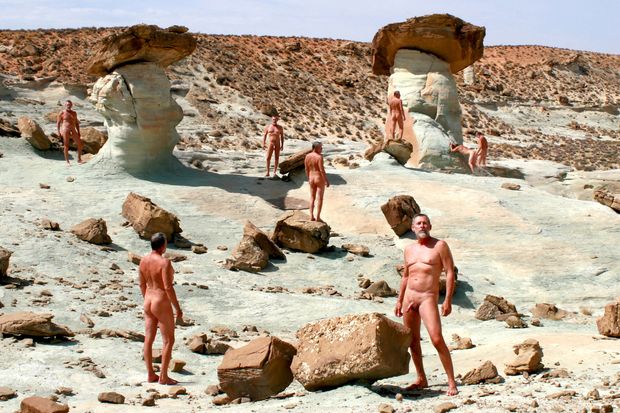 composite image of nude male posing in desert