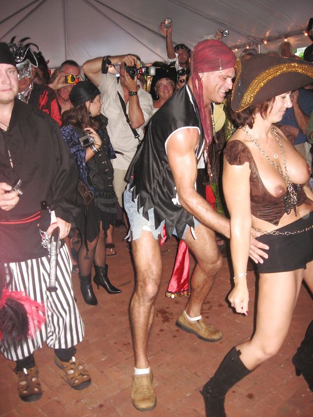 Costume party pirate showing her boobs and probably pantyless.