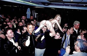 Not sure what this event is, but she is being groped nude in a large crowd of men.