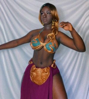 It feels not PC to call this cosplay by the traditional name.