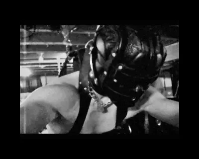 Intense suspension BDSM, edging, sensory deprivation hood, leather.