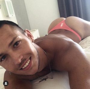 Sexy gay guy in peach thong