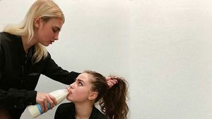 Make her to drink milk