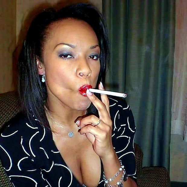 Beautiful ebony slut taking a long drag off a cigarette!