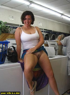 Smiling slutwife is washing her knickers.