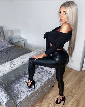 Sexy blonde in latex leggigns