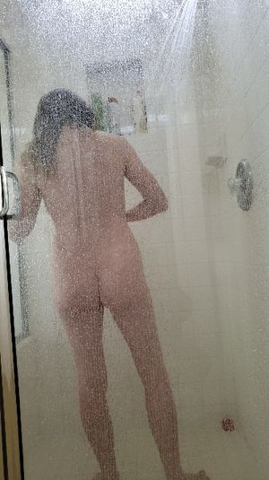 Spying on wife while she showers.