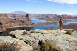composite gif of nude male overlooking lake
