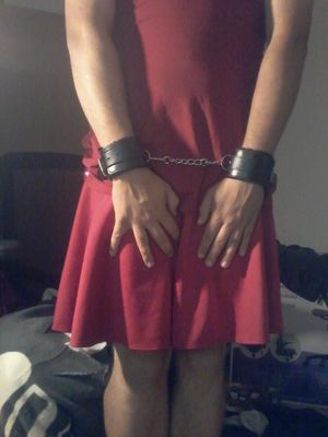 Posing in my sexy skirt and handcuffs