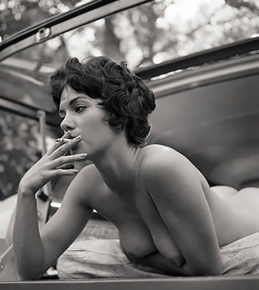 First she sucks on a cig, then on a cock.