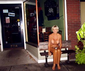 Topless Sitting outside store on Frankfort Avenue.