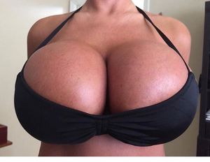 WE LOVE HUGE FAKE BREAST IMPLANTS