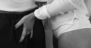 Rubbing his cock over his pants