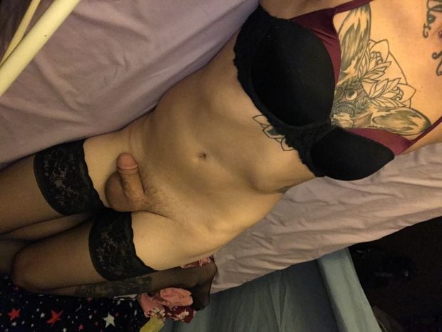 Tattooed femboy in stockings