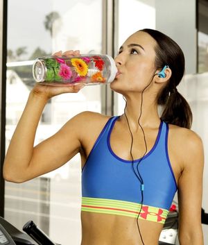 drinking water in a sports bra
