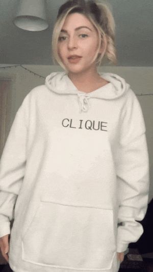 Lifting her hoodie