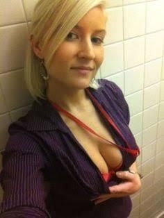 Cute blonde cheeky bathroom selfie at work.