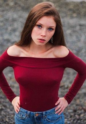 Sexy brunette with freckles showing off her pokies