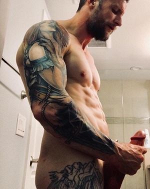 Admiring his own beefy cock.