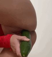 Fucking my pussy with a cucumber.