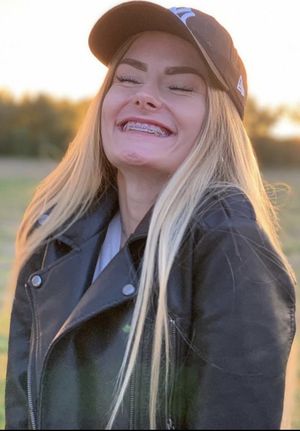 clothed teen with braces