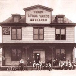 Stockyard/slaughterhouse were meat auction is held, and ladies butchered.