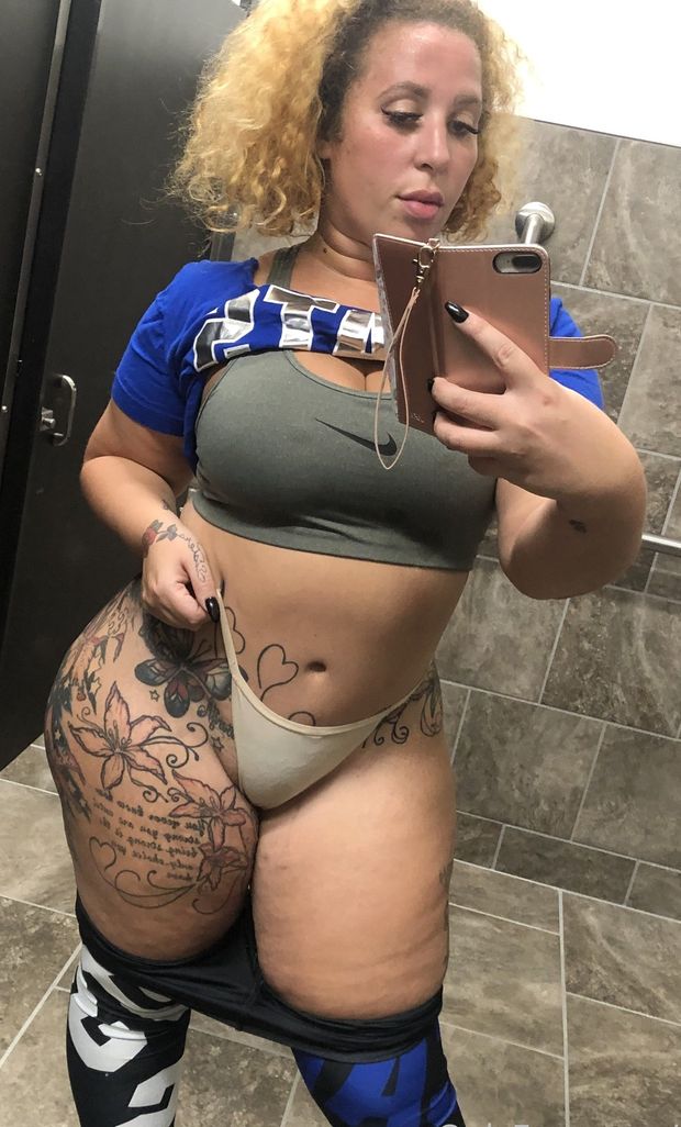 Thunda showing off sports bra
