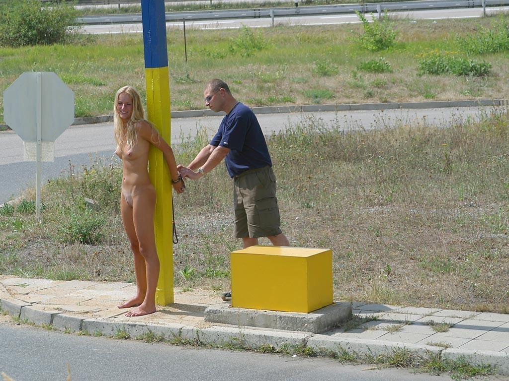 tied to pole, stripped and left exposed