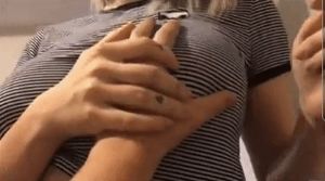 Groping her tits before she shows them