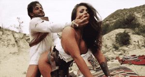 Gang leader enjoying the woman kidnapped by his gang members from the town for nightly use