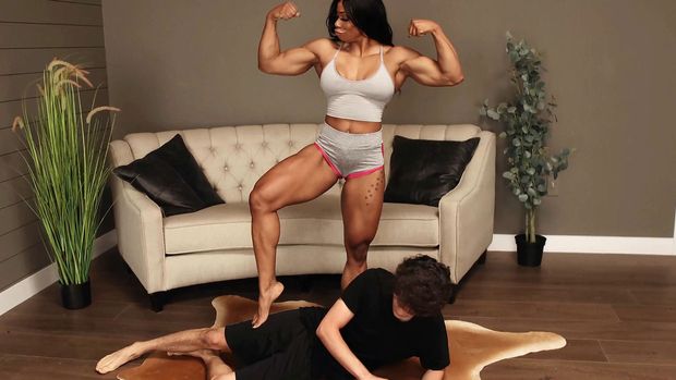 Black female bodybuilder humiliates weak white man with her big muscles