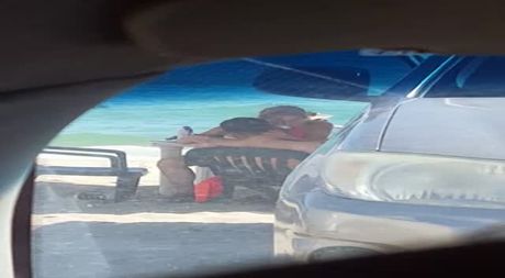 Trying to break the chair at the beach