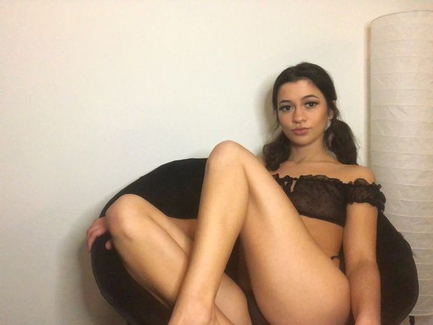 Brunette teen with pigtails in mesh lingerie set.