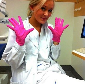 Cute doctor with pink gloves