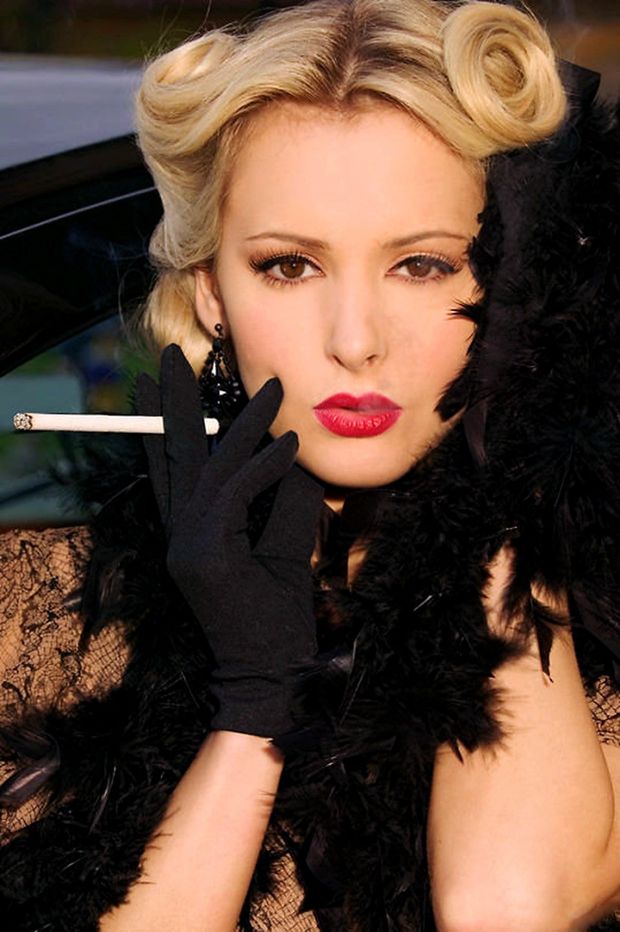 Beautiful retro style lady having a cigarette