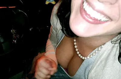 smiling handjob in the car
