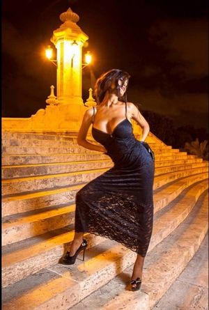 Busty amateur posing in black evening dress