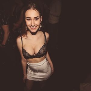 Hot party chick in mini skirt and bra
