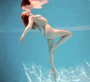 kissing her reflection