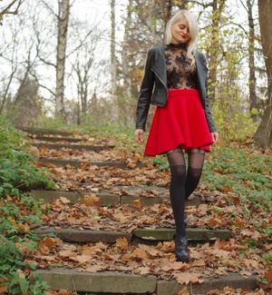 Leggy blonde in red mini skirt and sheer top outdoors