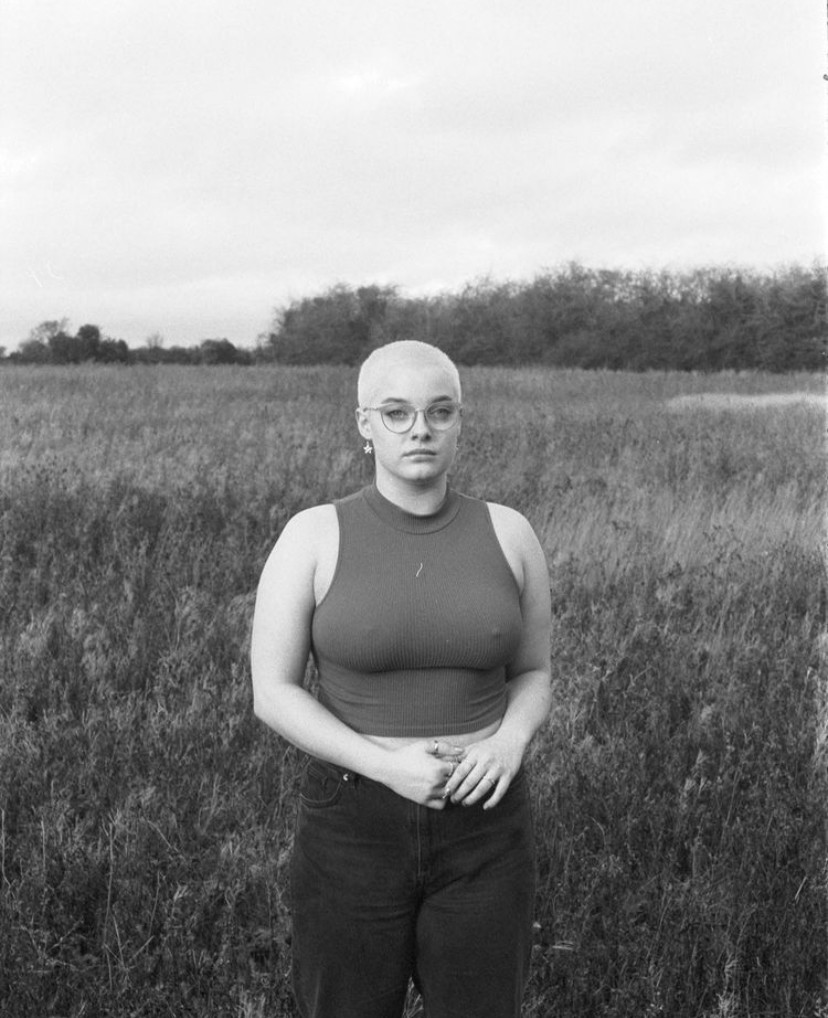 Busty goth with shaved head