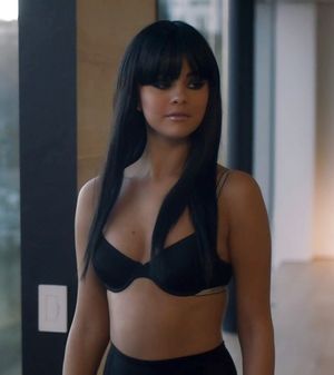 Selena with bangs in a bra