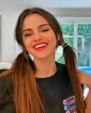 Selena in lipstick and pigtails