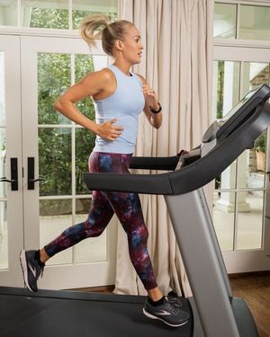 Carrie runs on a treadmill