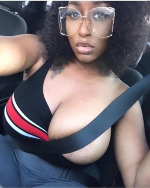 One tit all the way out while in traffic