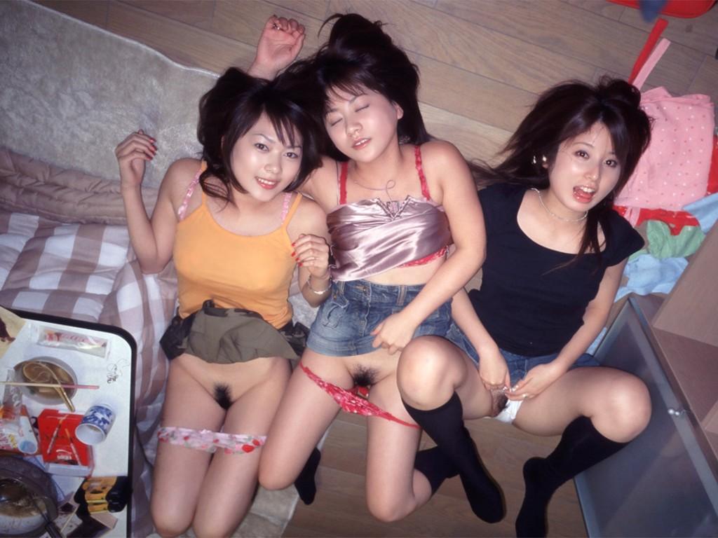 Beautiful asians next to passed out friend